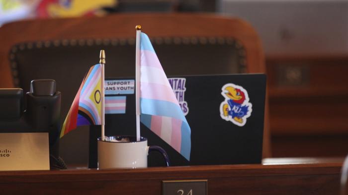 Small transgender rights flags sit on the desk in the Kansas House chamber for Rep. Allison Hougland, D-Olathe, during a break in the House's daylong session, Monday, April 29, 2024, at the Statehouse in Topeka, Kan. 