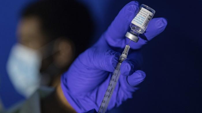 A family nurse practitioner prepares a syringe with the Mpox vaccine for inoculating a patient at a vaccination site in the Brooklyn borough of New York, on Tuesday, Aug. 30, 2022. 