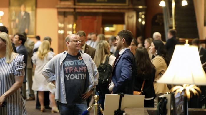 Brent Cox, left, talks to Josh Malkin, right, of the South Carolina chapter of the American Civil Liberties Union, right, as they wait to talk to lawmakers in the lobby of the Statehouse on Wednesday, May 1, 2024, in Columbia, S.C.