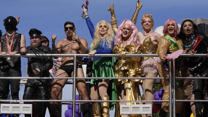 Revelers dance on a traveling stage during the annual Gay Pride Parade in Sao Paulo, Sunday, June 2, 2024.