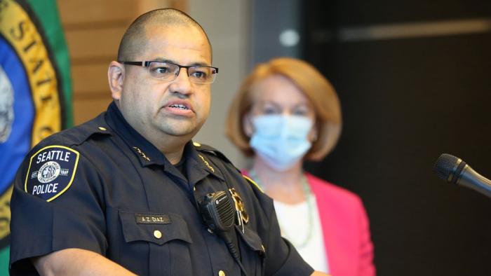 Adrian Diaz, Deputy Chief of Seattle Police speaks at a press conference as Seattle Mayor Jenny Durkan (R) looks on at Seattle City Hall on August 11, 2020 in Seattle, Washington. Seattle Police Chief Carmen Best announced her resignation. Diaz will serve as Interim Chief of Police. Best's departure comes after months of protests against police brutality and votes by the City Council to defund her department by 14%. (Photo by Karen Ducey/Getty Images)