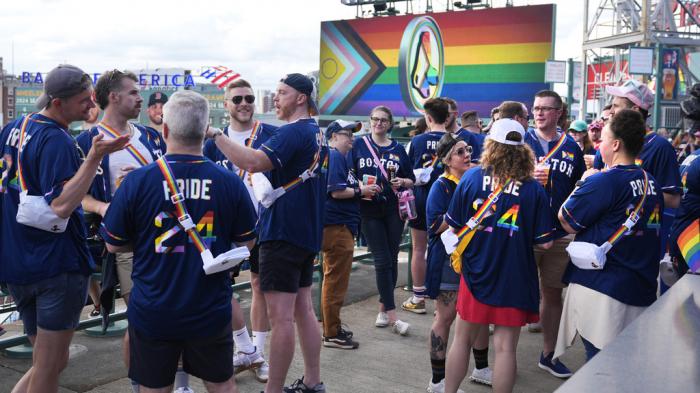 Fans gather for Pride Night prior to a baseball game between the Boston Red Sox and the Philadelphia Phillies, Tuesday, June 11, 2024, in Boston.