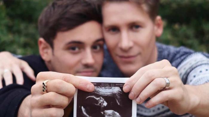 Olypic gold medalist diver Tom Daley and his husband, Oscar-winning screenwrite Dustin Lance Black, reveal an ultrasound of their son via surrogate on Valentine's Day, 2018