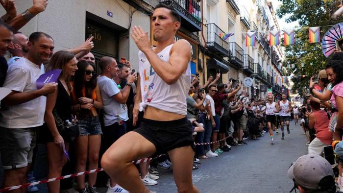 Participants compete during the Pride Week annual high heels race in the Chueca district, a popular area for the gay community in Madrid, Spain, Thursday, July 4, 2024