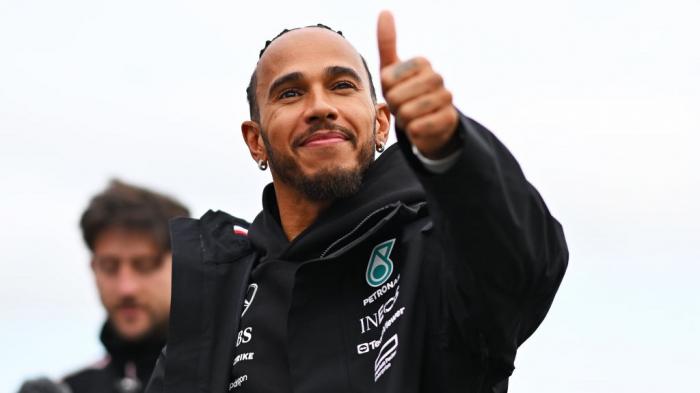 Lewis Hamilton of Great Britain and Mercedes waves to the crowd from the track during previews ahead of the F1 Grand Prix of Great Britain at Silverstone Circuit on July 04, 2024 in Northampton, England.