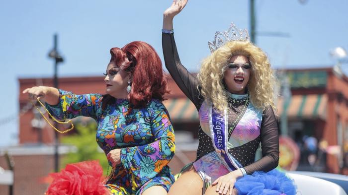 Pageant winners throw out beads during the Memphis PRIDE Festival & Parade, June 4, 2022, in Memphis, Tenn.