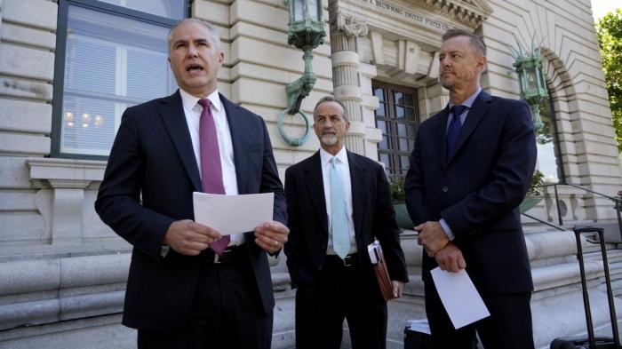 Ryan Tucker, left and David Cortman, attorneys with Alliance Defending Freedom, and Yakima Union Gospel Mission CEO Mike Johnson, right, speak to reporters outside the U.S. 9th Circuit Court of Appeals in San Francisco on Friday, July 19, 2024.