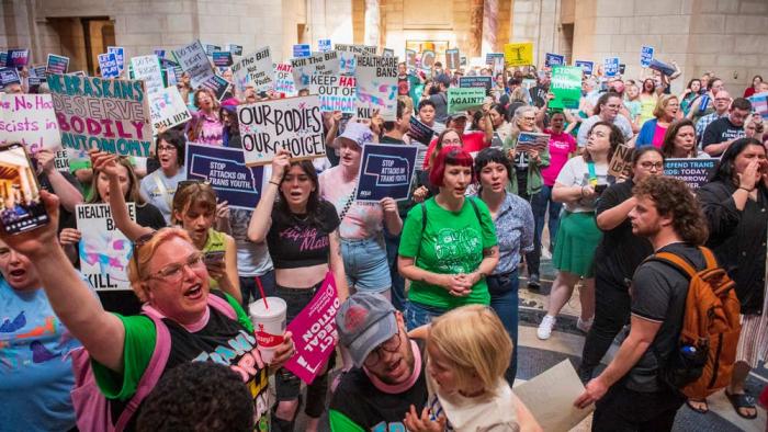 Protesters chant as they are heard in the legislative chamber during a final reading on a bill that combined a 12-week abortion ban with a measure to restrict gender-affirming care for people under 19, May 16, 2023, at state Capitol in Lincoln, Neb