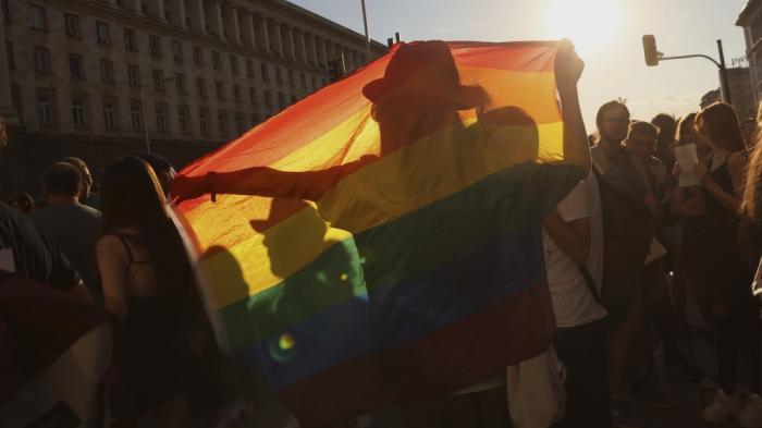 Protesters rally outside Bulgaria's parliament, Thursday, Aug. 8, 2024 in Sofia, Bulgaria, to denounce a controversial legal amendment adopted the day before that bans talk of LGBTQ+ and so-called non-traditional sexual choices in schools. 