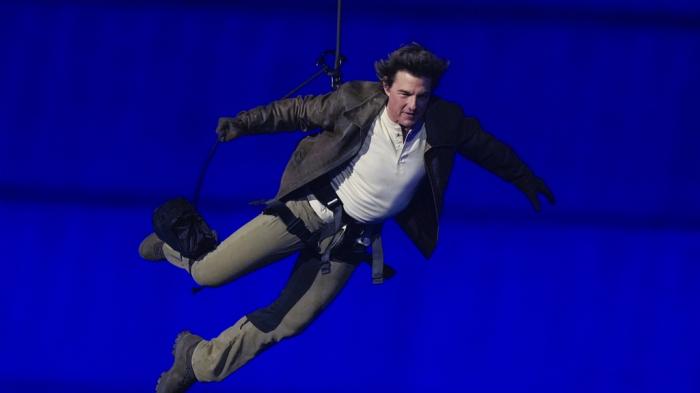 Tom Cruise is lowered on the Stade de France during the 2024 Summer Olympics closing ceremony, Sunday, Aug. 11, 2024, in Saint-Denis, France.