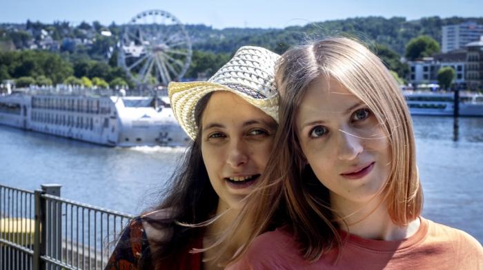 Freed Russian artist Sasha Skochilenko, left, and her partner, Sofya Subbotina, stand near the Mosel River in Koblenz, Germany, Saturday, Aug. 10, 2024. 