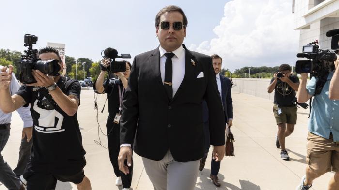 Former U.S. Rep. George Santos arrives at court in Central Islip, N.Y., Monday, Aug. 19, 2024.