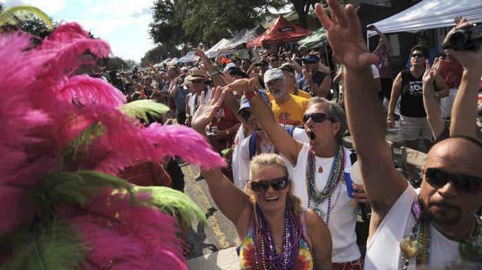 Hundreds of people line Central Avenue and cheer during the 10th Annual St. Pete Pride Street Festival & Promenade in St. Petersburg, Fla. on June 30, 2012.