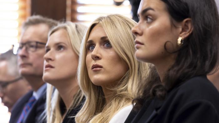 Former collegiate swimmers Kaitlynn Wheeler, from third left, Riley Gaines, and Grace Countie, who competed in Georgia but aren't from the state, prepare to testify in opposition to transgender athletes in women's sports in front of the state senate's Special Committee on Protecting Women's Sports at the Capitol in Atlanta, Tuesday, Aug. 27, 2024. 