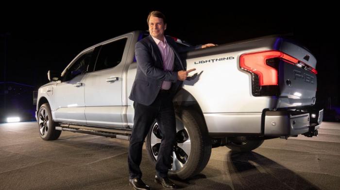 Jim Farley, CEO of Ford Motor Company, poses with the new all-electric F-150 Lightning performance truck at its reveal at Ford World Headquarters on May 19, 2021 in Dearborn, Michigan. 