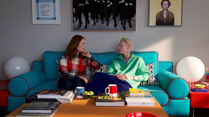 Julianne Moore, left, and Tilda Swinton in a scene from "The Room Next Door."