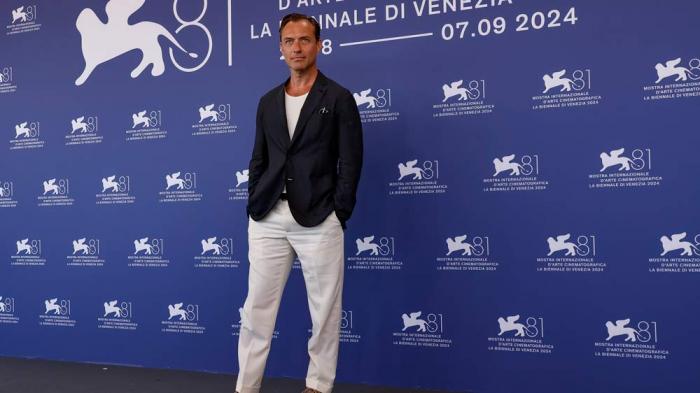 Jude Law poses for photographers at the photo call for the film 'The Order' during the 81st edition of the Venice Film Festival in Venice, Italy, on Saturday, Aug. 31, 2024. (Photo by Joel C Ryan/Invision/AP)