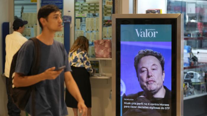 An ad by Valor media shows a photo of Elon Musk at a shopping center in Brasilia, Brazil, Monday, Sept. 2, 2024. The sign reads in Portuguese: "Musk creates profile on X against Moraes to leak confidential decisions of the Supreme Court," referring to Supreme Court Justice Alexandre de Moraes who ordered the platform blocked for having failed to name a local legal representative as required by law