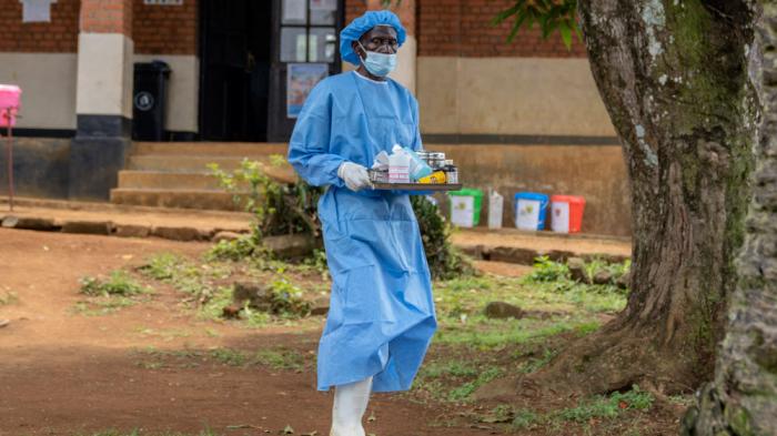 A health worker carries medication to be giving to a man suffering for mpox at the Kamituga General Hospital in South Kivu Congo, Wednesday, Sept. 4, 2024