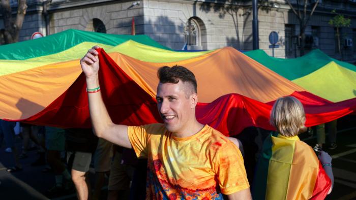 People carry a large rainbow flag while attending a pride march in Belgrade, Serbia, Saturday, Sept. 7, 2024 as they demand that the government improve rights for the LGBTQ+ community who often face harassment and discrimination in the highly conservative Balkan country