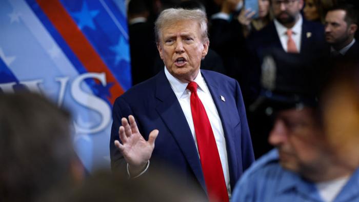 Republican presidential nominee, former President Donald Trump talks to journalists in the spin room after he debated Democratic presidential nominee, U.S. Vice President Kamala Harris at The National Constitution Center on September 10, 2024 in Philadelphia, Pennsylvania