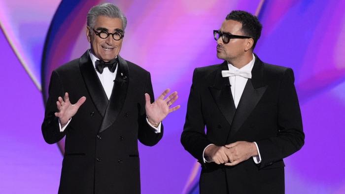 Hosts Eugene Levy and Dan Levy speak during the 76th Primetime Emmy Awards on Sunday, Sept. 15, 2024, at the Peacock Theater in Los Angeles. 