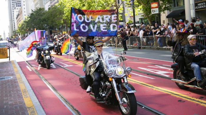 Bikers, center, ride a Harley Davidson motorcycle in the annual Pride Parade in San Francisco June 30, 2024.