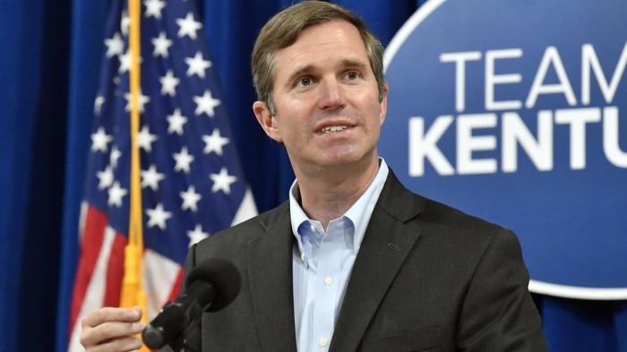 Kentucky Gov. Andy Beshear speaks to a group gathered to celebrate the governor signing an executive order banning the use of "conversion therapy" on minors, Wednesday, Sept. 18, 2024, in Frankfort, Ky. 