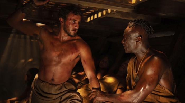 Paul Mescal, left, and Peter Mensah in a scene from "Gladiator II."