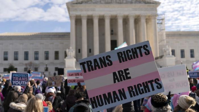 Transgenders rights supporters rally outside of the Supreme Court, Wednesday, Dec. 4, 2024, in Washington. 