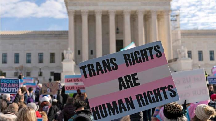 Transgenders rights supporters rally outside of the Supreme Court, Wednesday, Dec. 4, 2024, in Washington