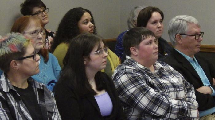 People listen to opposition testimony on a resolution that would urge the U.S. Supreme Court to overturn its 2015 decision that legalized same-sex marriage nationwide, Wednesday, March 12, 2025, at the state Capitol in Bismarck, N.D. 