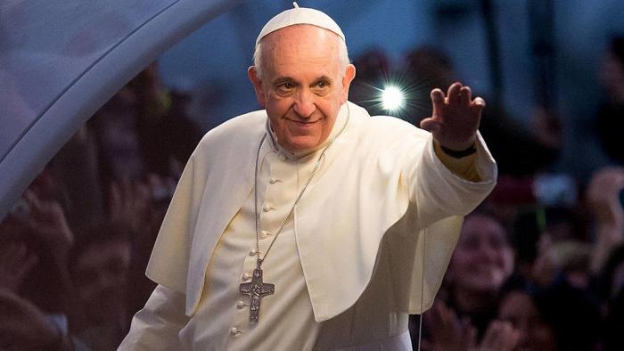Pope Francis waves from the Popemobile on his way to attend the Via Crucis on Copacabana Beach during World Youth Day celebrations on July 26, 2013 in Rio de Janeiro, Brazil