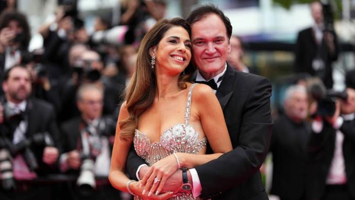 Daniella Pick, left, and Quentin Tarantino pose for photographers during the opening ceremony red carpet of the 78th international film festival, Cannes, southern France, Tuesday, May 13, 2025