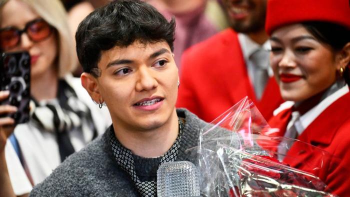 JJ, center, from Austria arrives at the airport in Vienna, Austria, Sunday, May 18, 2025, after winning the Grand Final of the 69th Eurovision Song Contest, in Basel yesterday