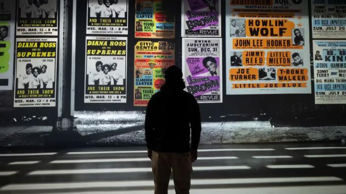A man looks at part of the Amplified, The Immersive Rock Experience in New York City.