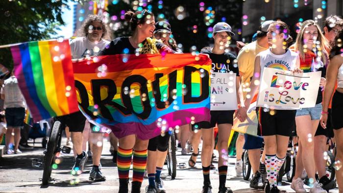 People walk in the Pittsburgh Pride Revolution March to celebrate Pride Month, June 4, 2022, in downtown Pittsburgh