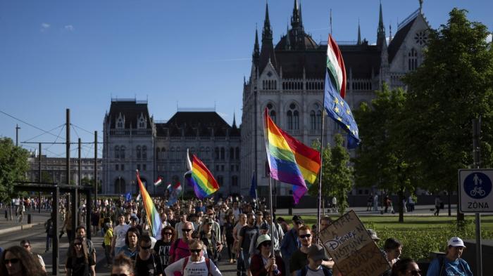 Hungarians march in downtown Budapest to protest against a new law banning LGBTQ+ Pride events and the populist government's restriction on assembly rights, which many critics of Prime Minister Viktor Orbán see as a crackdown on their freedom on Thursday, May 1, 2025.