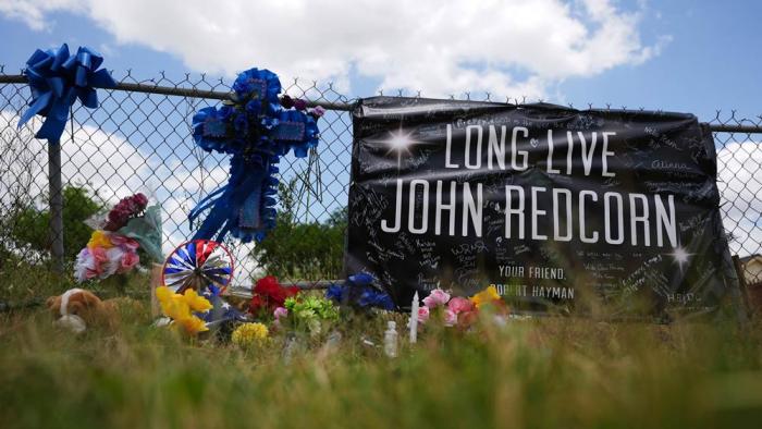 Candles, flowers, and notes are placed at a makeshift memorial in San Antonio, on Thursday, June 5, 2025, for voice actor Jonathan Joss who was recently killed