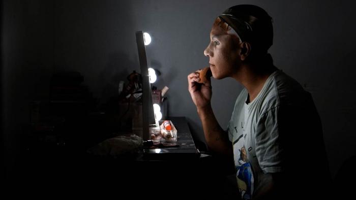 Mari Con Carne applies their makeup before attending Les Miserables at the Kennedy Center in drag, on the night that President Donald Trump and first lady Melania Trump were also in attendance, Wednesday, June 11, 2025, in Washington