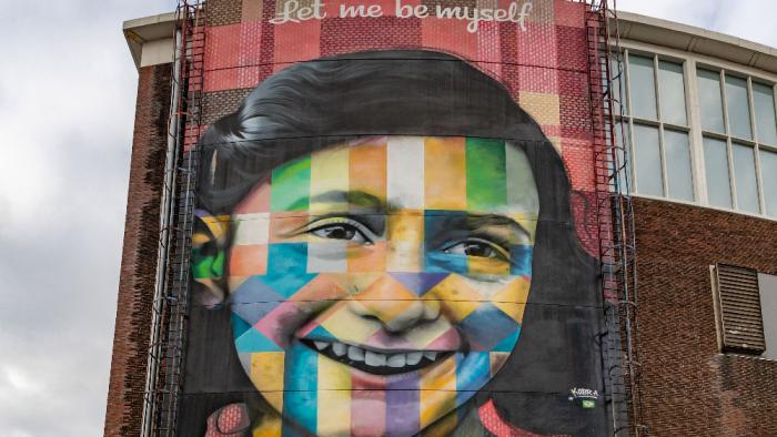 A picture of the Let Me Be Myself colorful mural, depicting Anne Frank, created by Eduardo Kobra in 2016.