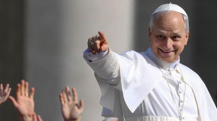 Pope Leo XIV waves as he arrives in the Popemobile ahead of the Inauguration Mass of Pope Leo XIV in St Peter's Square on May 18, 2025 in Vatican City, Vatican