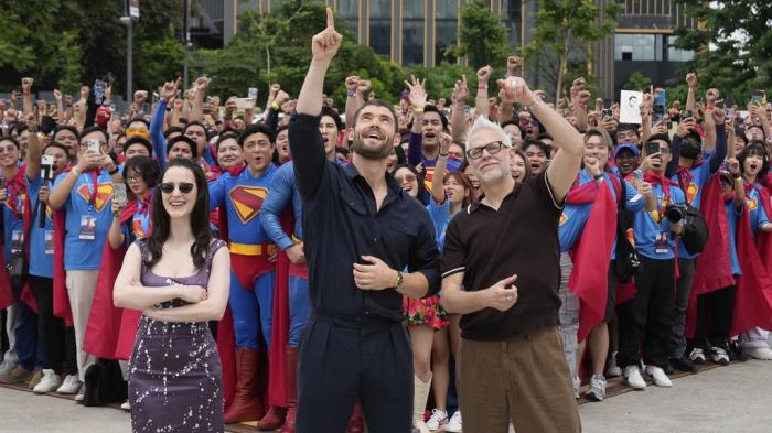 Superman stars David Corenswet, center, Rachel Brosnahan, left, and writer, director, and producer James Gunn pose with fans during the first stop of the Superman World Tour in Pasig city, Philippines on Thursday June 19, 2025.