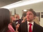 Watch: Harried Santos Staffer Looks for an Exit Among Swarm of Reporters