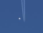 US Downs Chinese Balloon Over Ocean, Moves to Recover Debris
