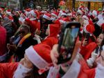 Thousands of Santas and a Few Grinches Hit the Streets for Annual SantaCon Bar Crawls 